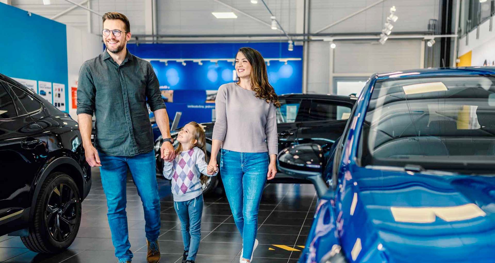 A family at a car dealership