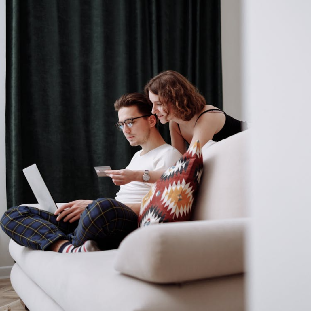 Couple reviewing mortgage paperwork and refinancing options.