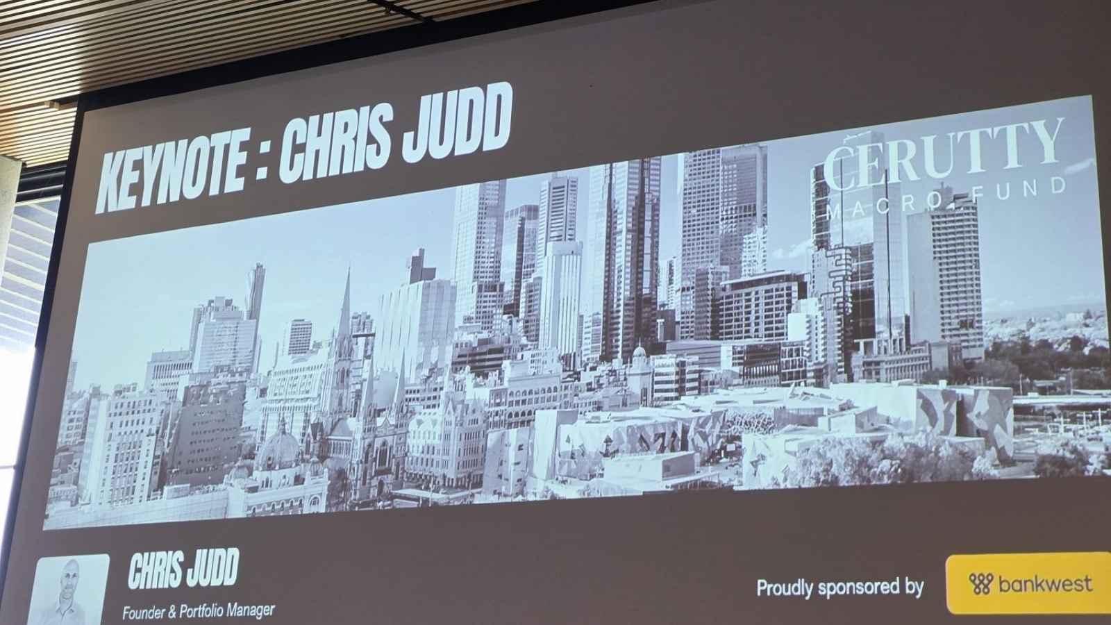 Keynote slide for Chris Judd with a grayscale city skyline background and Bankwest sponsorship.