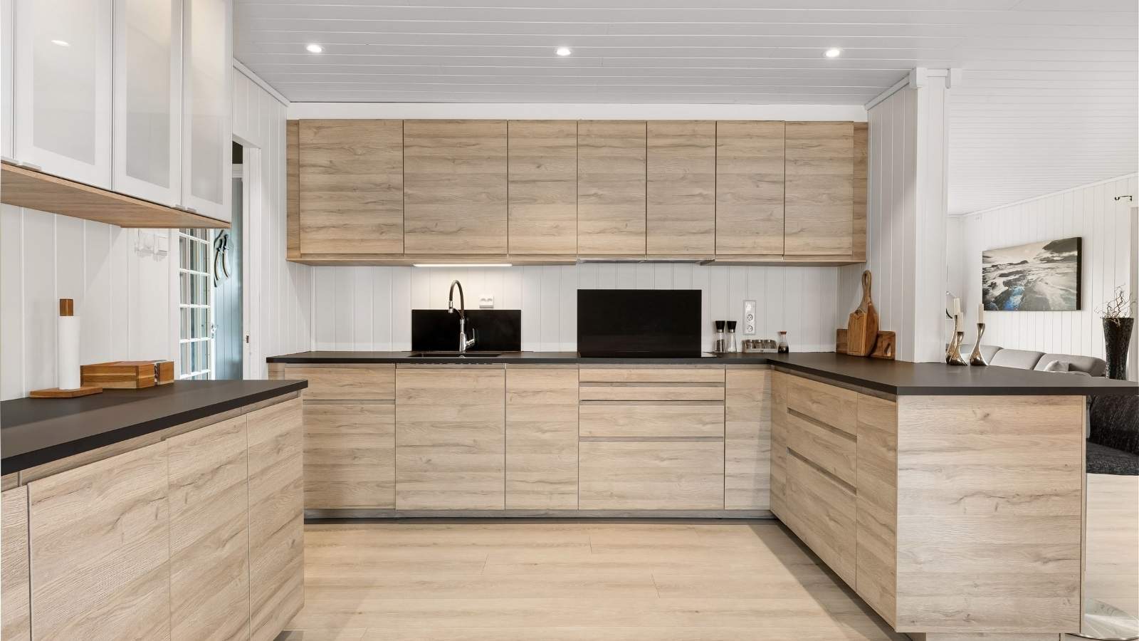 A clean, modern kitchen with upgraded wooden cabinetry